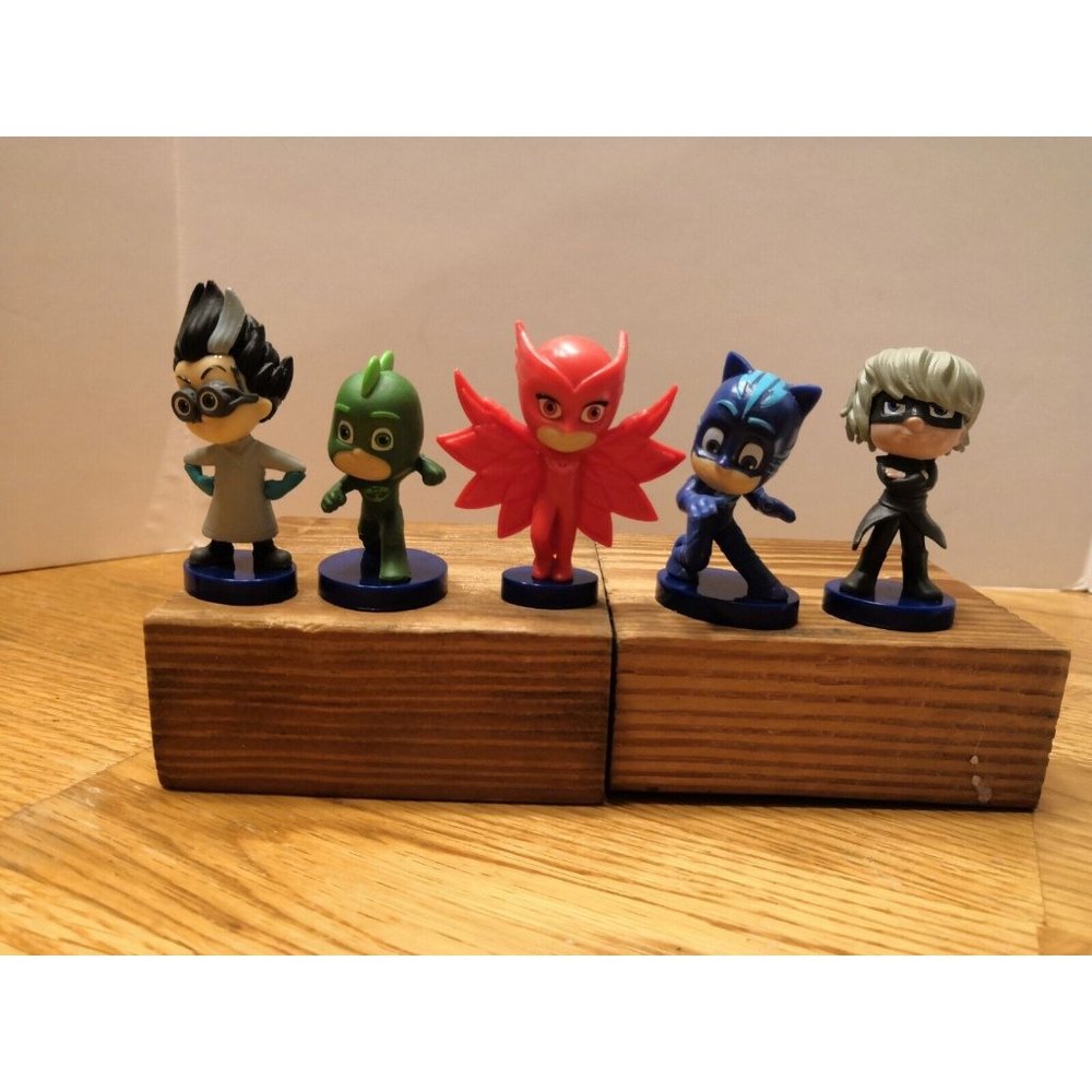 Five P.J. Masks figurines cake toppers.